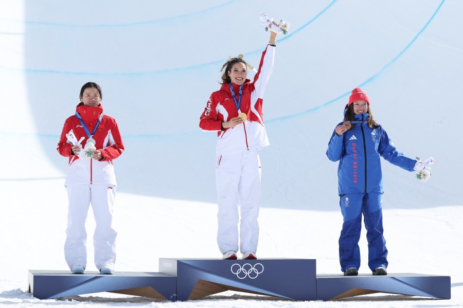 Gold medalist Ailing Eileen Gu of Team People’s Republic of China, Silver medalist Fanghui Li of Team People’s Republic of China and Bronze medalist Zoe Atkin of Team Great Britain celebrate on the podium